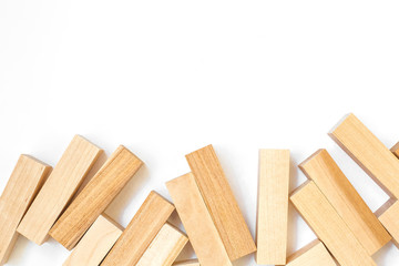 wooden blocks of the game lie on a white background below the frame with free space on top