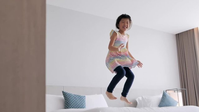 girl jump on the bed