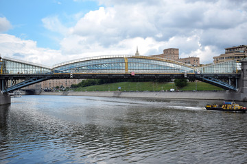 The view of Bogdan Khmelnitsky pedestrian bridge across Moskva river from the Berezhkovskaya embankment 