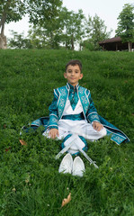 circumcision boy dressed in traditional clothing