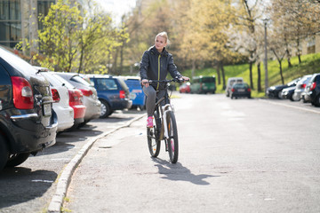 woman commuting on bicycle and looking at camera