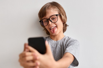 Funny boy taking selfie