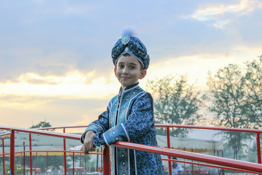 circumcision boy dressed in traditional clothing
