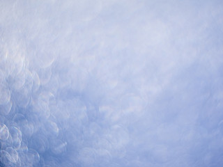 Light-blue background of shining drops of water