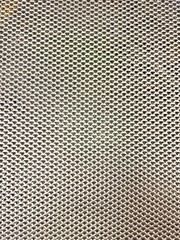Metal mesh with small holes, silver color. To use for the background texture.
