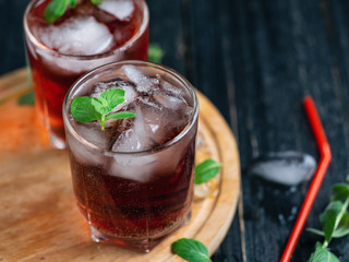 Red summer alcoholic cocktails with ice and mint . Without soda and with soda