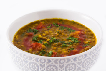 Indian lentil soup dal (dhal) in a bowl isolated on white background. Close up