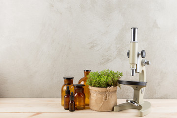 Medicine in bottles made of honey and fresh herbs