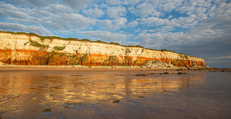 The famous red and white chalk cliffs of Hunstanton in Norfolk, England.