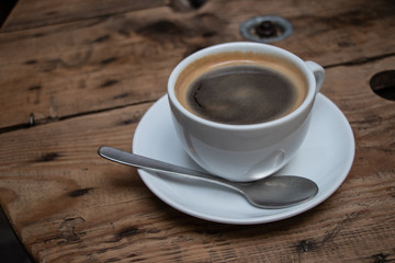 cup of coffee on wooden table