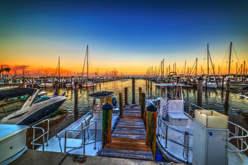 Boats in Coconut Grove harbor at sunset