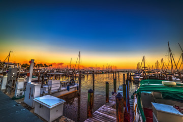 Boats in Coconut Grove harbor at sunset
