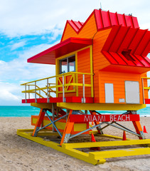 Colorful lifeguard tower under a cloudy sky in Miami Beach