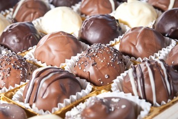 mixed white, brown and dark selfe made chocolate praline
