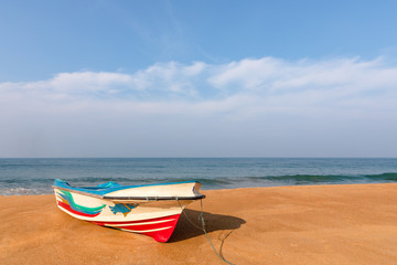 A boat on the sand beach, Mount Lavinia, Sri Lanka