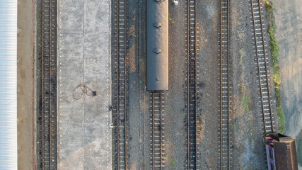 Aerial view of diesel locomotive Train and railway tracks - top view pov of Industrial conceptual scene with trains as abstract background. © KissShot