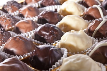 mixed white, brown and dark selfe made chocolate praline