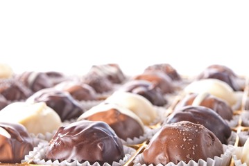mixed white, brown and dark selfe made chocolate praline