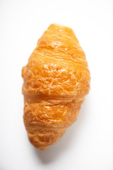 Vertical shoot of croissant on white background. Isolated.