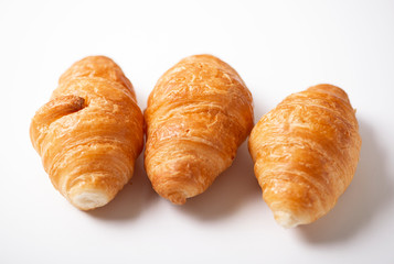 Close-up of three croissants on white background. Isolated.