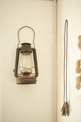 Oil lamp and clothespins. Retro home decoration.