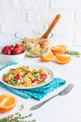 Healthy and simple food, light summer lunch, fragrant salad with couscous and oranges