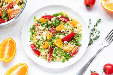 Healthy and simple food, light summer lunch, fragrant salad with couscous and oranges