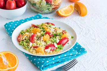 Healthy and simple food, light summer lunch, fragrant salad with couscous and oranges
