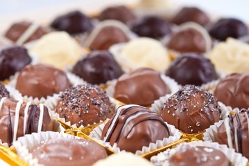 mixed white, brown and dark selfe made chocolate praline