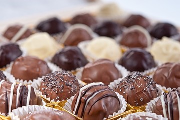 mixed white, brown and dark selfe made chocolate praline