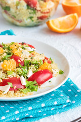 Healthy and simple food, light summer lunch, fragrant salad with couscous and oranges