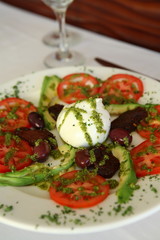 Caprese salad with olives and avocado