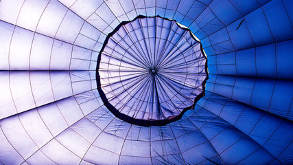 Close-up of the inside of a blue hot air balloon