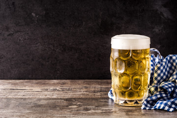 Oktoberfest beer on wooden table. Copyspace