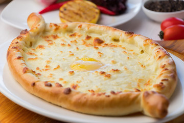 Adjarian Khachapuri with cheese sulguni - Georgian cuisine