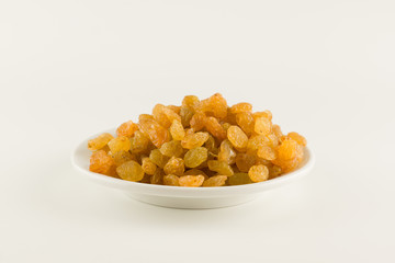 Fresh picked raisins isolated on white background