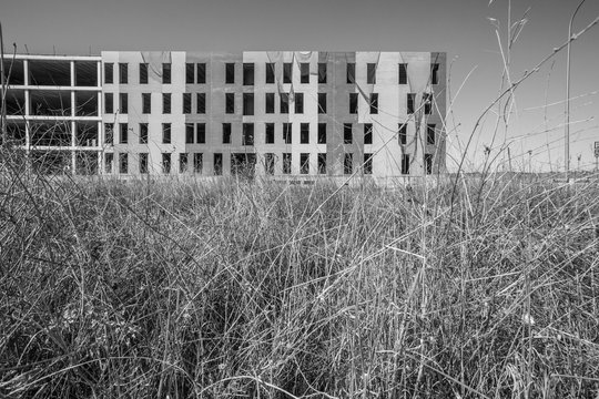 Unfinished construction site with erected concrete frame of building
