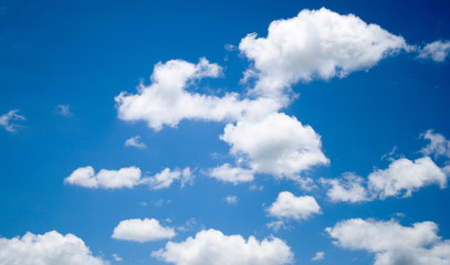 Naklejka na ściany i meble landscape blue sky and the clouds. The clouds are shaped like a flying dragon. 