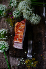 The cut  a Smoked bacon on a cutting board