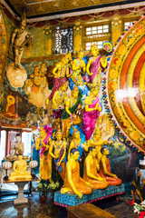 Group of statues in the temple of Gangaramaya, Colombo, Sri Lanka. Vertical.