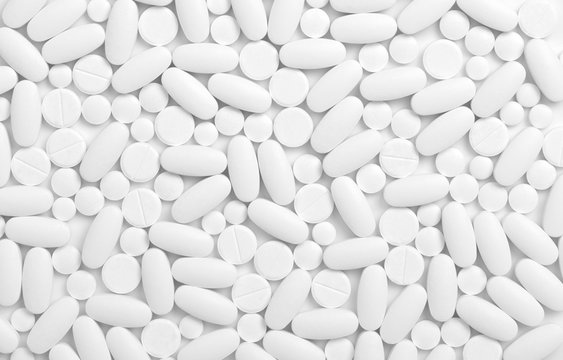  white pills background © Alekss