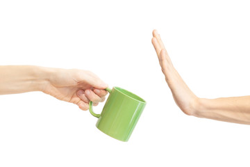 Say no green cup. Man says no to mug. Hand gesture to reject proposal to drink from green mug....