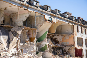 destroyed building with collapsed walls and floor