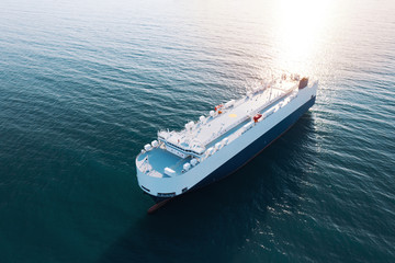 Aerial view of high-speed sea vessel for transportation of cargo vessel at high speed is drifting...