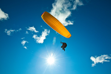 A male paraglider contrasts with the bluebird day while paragliding at Steptoe Butte in eastern Washington.    