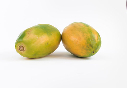 Two yellow and green papaya isolated on white background fresh papaya, pure vitamin