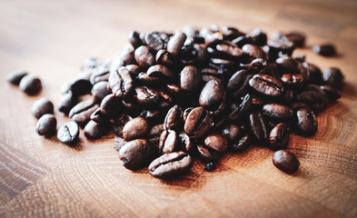 Coffee beans on wooden background