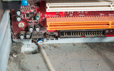 Old computer system unit with dust and spiderweb inside.