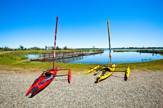Two Hobie Mirage Adventure Island sail kayaks await use at Sacajawea Park outside Pasco, Washington.       