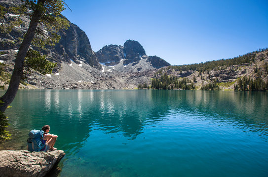 Bekah Davis rests by the beautiful Sheep Lake in the Seven Devil Mountains in Central Idaho.  He Devil sits prominantly in the background.